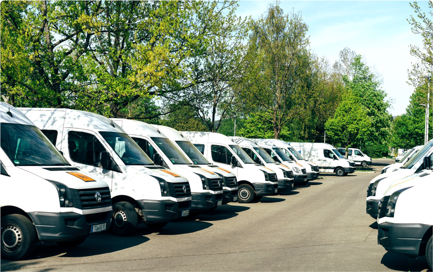 Fleet of vans in parking lot